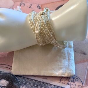 #1 💕White Crystals spaced out against faded peach tones crystal bracelet.